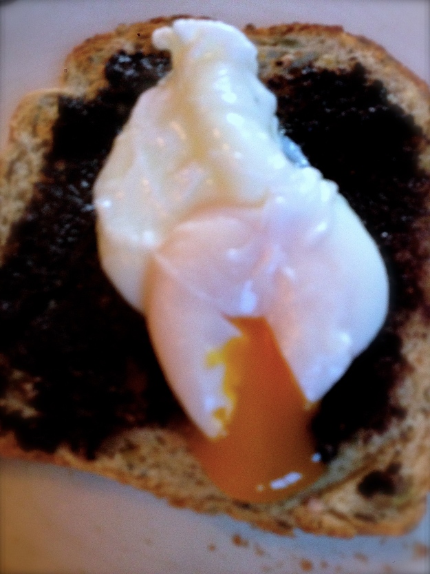 Poached egg on a bed of black gold...
